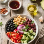 Dense bean salad with fresh vegetables and herbs