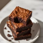 Stack of chewy brownies with gooey center
