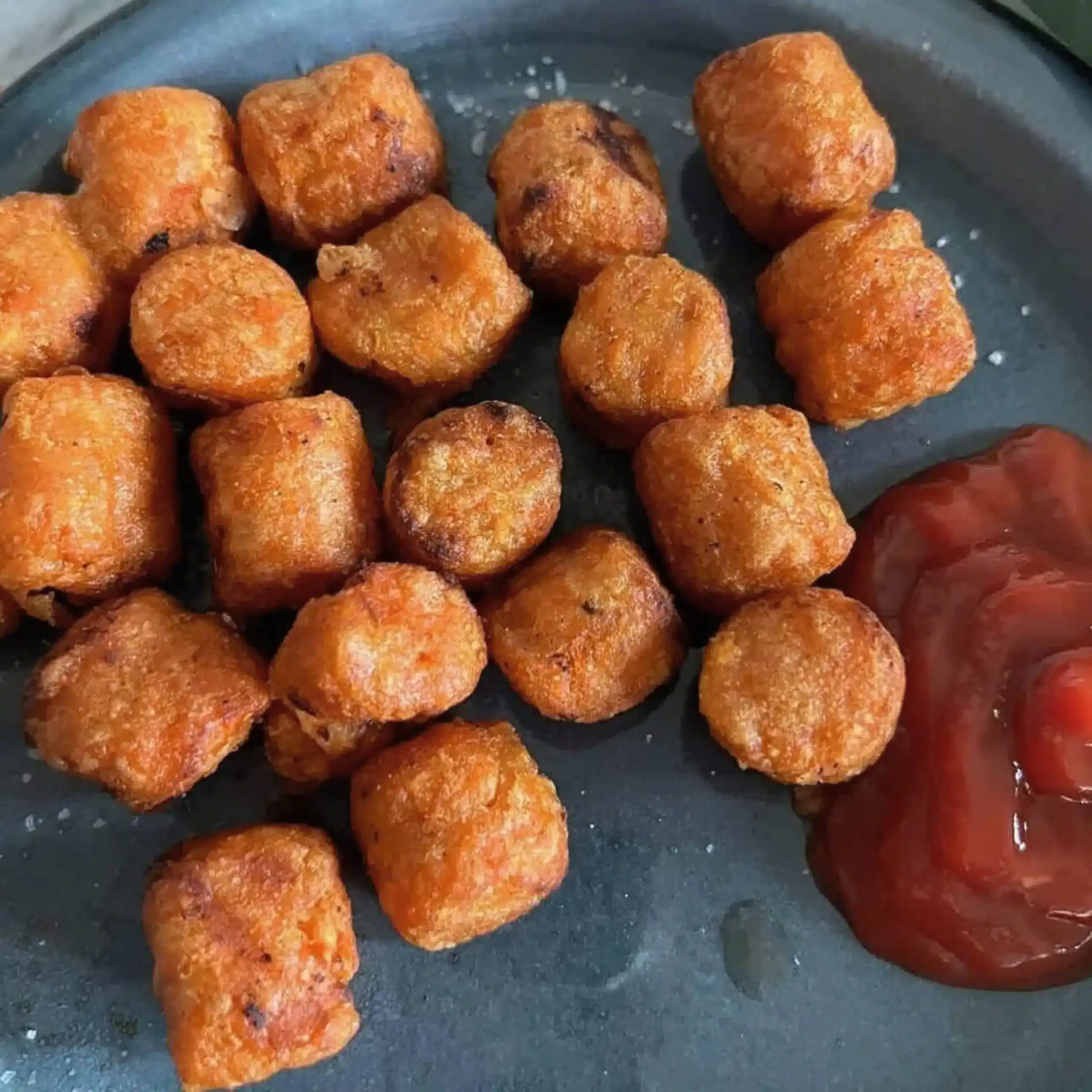 Cooked Alexia sweet potato puffs with ketchup