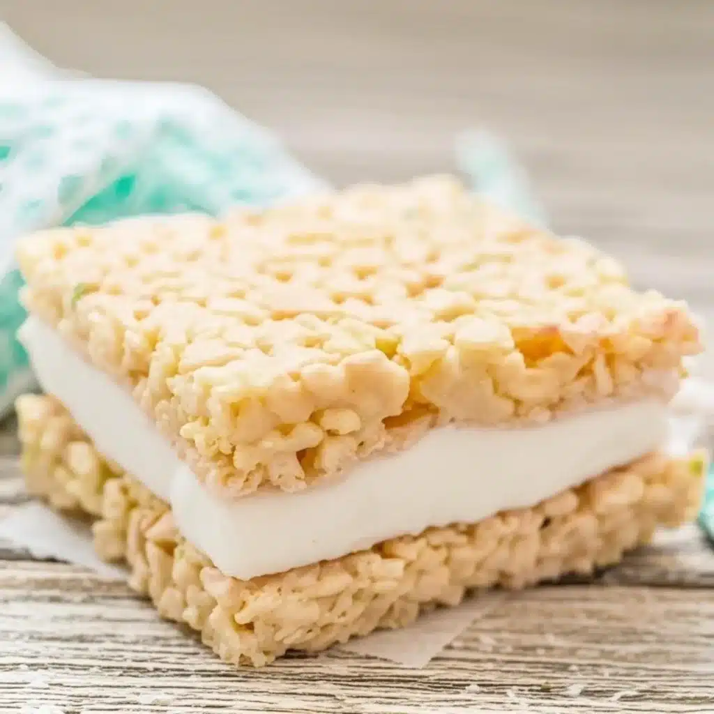 close-up of a classic rice krispie ice cream sandwich with white vanilla filling