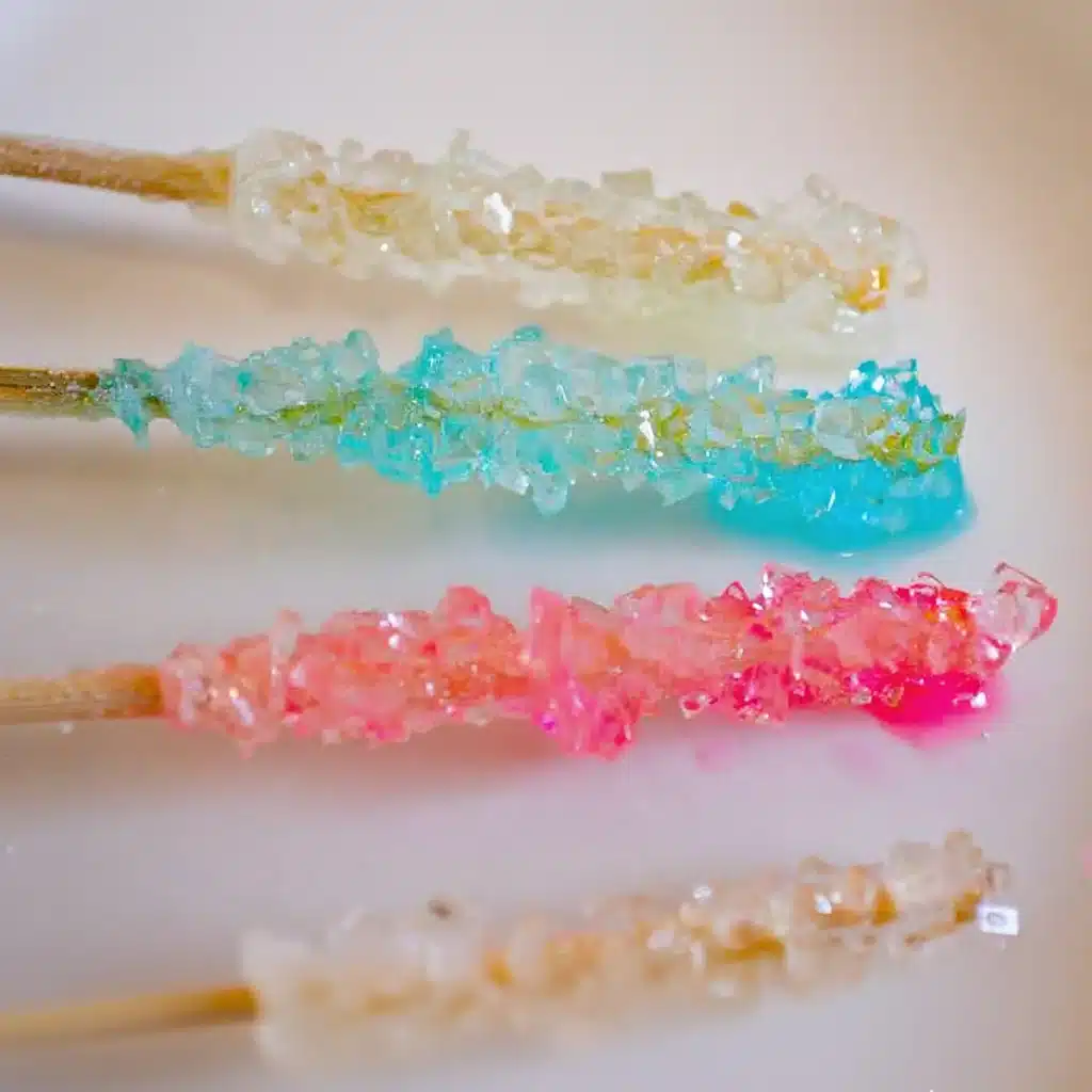 Rock Candy Recipe That Turns Sugar Into Sparkling Magic 4 Assorted pastel rock candy recipe sticks with sugar crystals